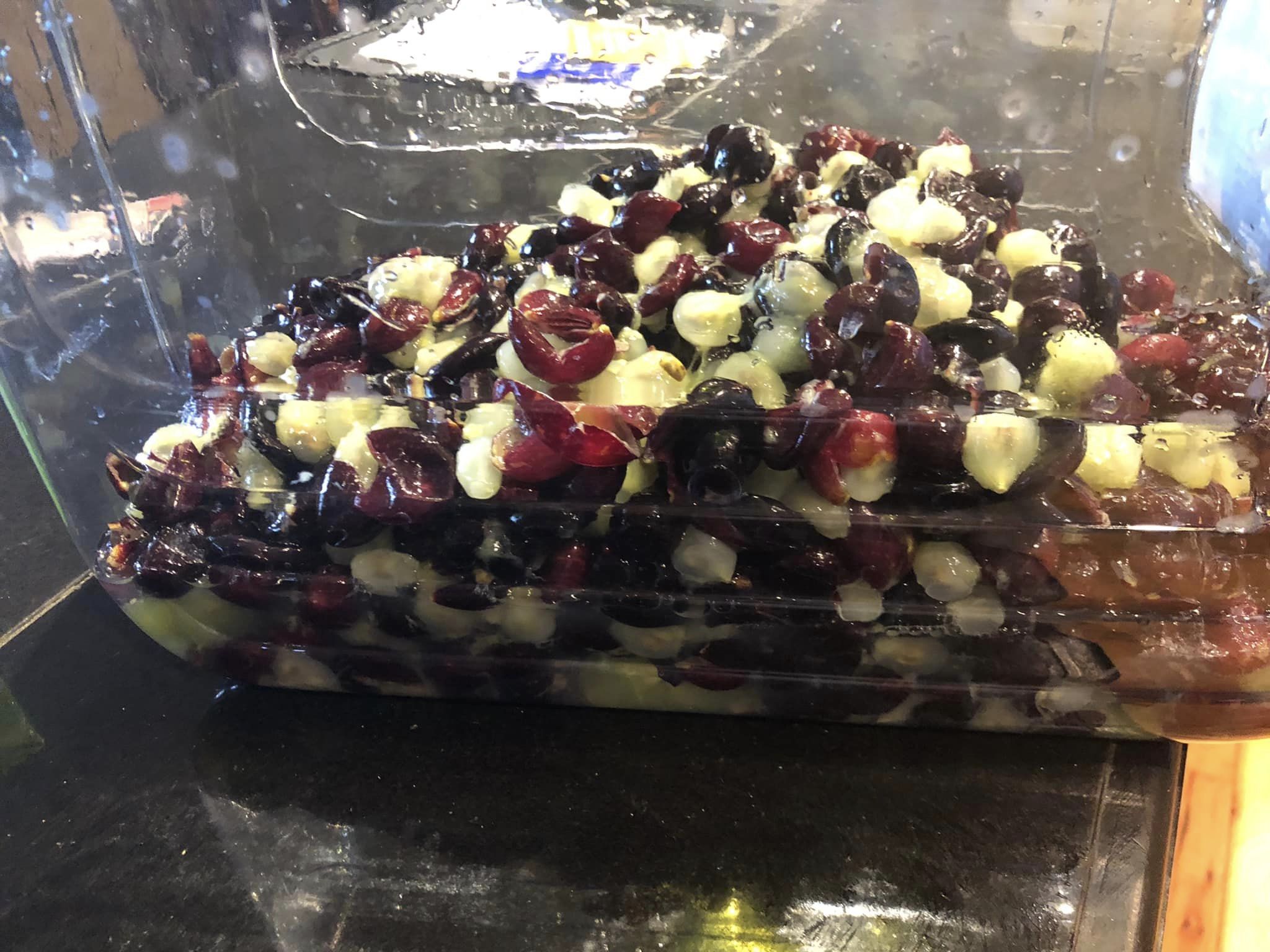 Crushed grapes ina plastic container